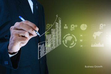 business man drawing growth graph.