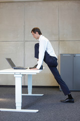 exercises in office. business man  stretching
