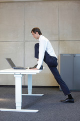exercises in office. business man  stretching