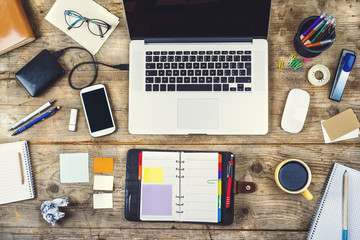 Desktop mix on a wooden office table.