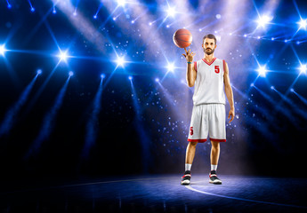Basketball player is spinning ball around the finger