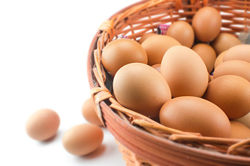 Chicken brown eggs in wicker basket
