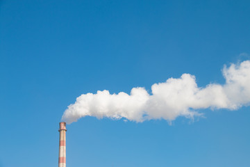 Factory chimney in winter