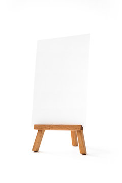 Small easel with white vertical sheet of paper
