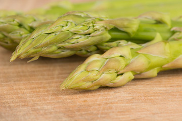 closed up asparagus on wood floor
