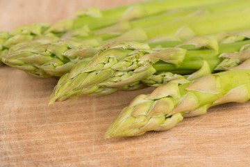 closed up asparagus on wood floor