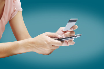 Woman shopping using credit card on white background