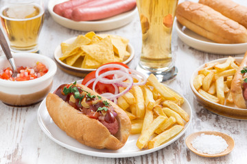 hot dogs with French fries, beer and snacks