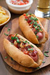 hot dogs with tomato salsa and onions, vertical