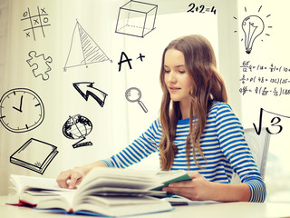 Fototapeta premium smiling student girl reading books at home