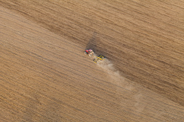 aerial view of tractor on harvest field