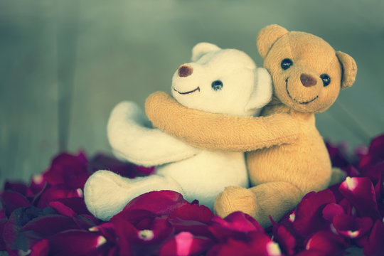 vintage lovely hug lovely teddy bears on red rose petals