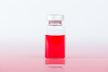 Red liquid in injection vial and shadow effect
