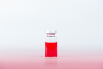 Red liquid in injection vial and shadow effect