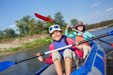Girl with mother kayaking