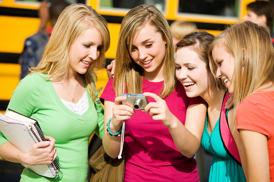 School Bus: Girls Laughing at Picture on Camera