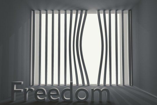 bent prison bars and the inscription freedom