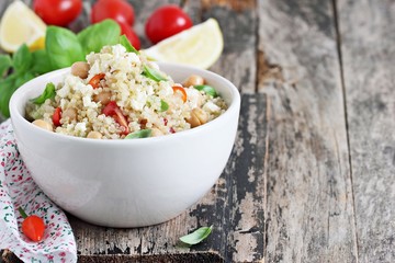 Quinoa salad with vegetables,chickpea and feta.Selective focus.