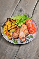 Grilled pork chop on rustic table