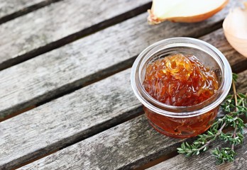 Homemade onion marmalade on a rustic table.Selective focus.