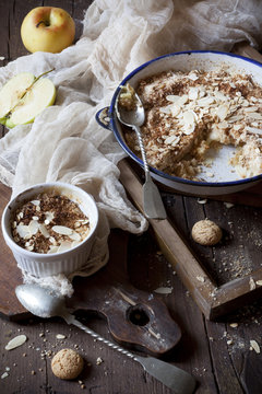 apple crumble with almonds on rustic table