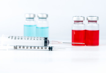 Disposable syringe and injection vials