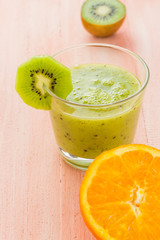 Healthy diet fruit juice kiwi orange wooden table