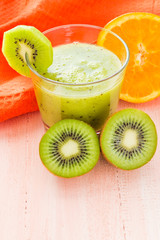 Healthy diet fruit juice kiwi orange wooden table