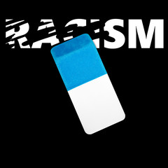 Eraser erasing the word RACISM