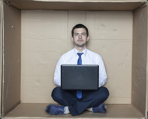 Portrait of a businessman sitting in front of computer