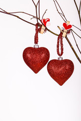 Valentine hearts hanging on a twig