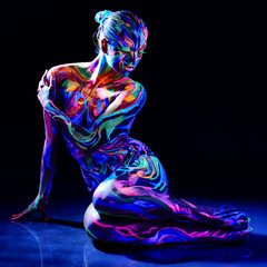Fototapeta premium Charming nude girl with luminescent body art