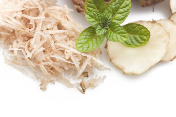 Topinambur, cut into slices and julienne on the table