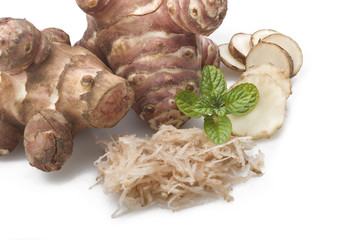 Topinambur, cut into slices and julienne on the table