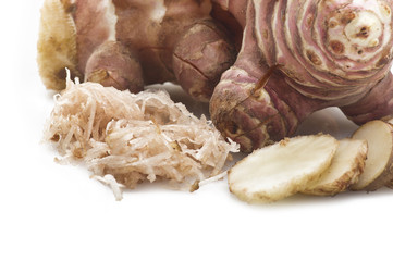 Topinambur, cut into slices and julienne on the table