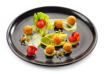 Plate of cheese balls and vegetables