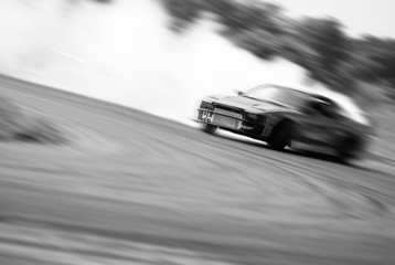 Very fast driving, motion blur drift black and white - obrazy, fototapety, plakaty