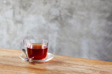 cup of tea on table in front of wall