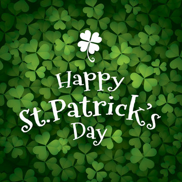 Happy Saint Patrick’s Day. Clover leaves background with text.
