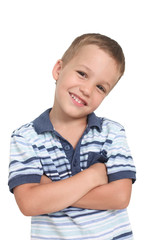 happy smiling little  boy with arms crossed  looking at camera on a white background