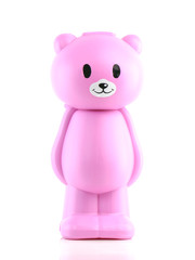 Close up of a plastic toy bear isolated on white background