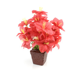 Artificial flowers in pot on white background