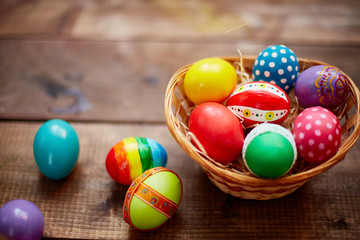 Fototapeta na wymiar Decorative eggs in basket