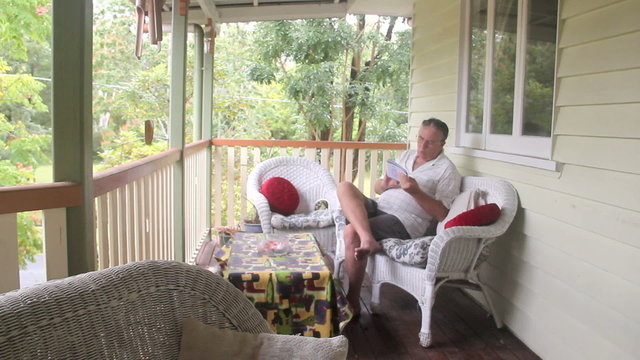 Mature man sitting and relaxing  playing sudoku