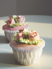 Cup cake dessert with Rose and flower decoration.