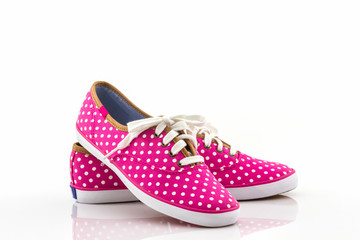 Pink polka dot canvas shoe.