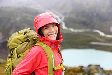 Happy young asian hiker woman hiking portrait