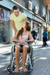 Social worker taking invalid for a walk