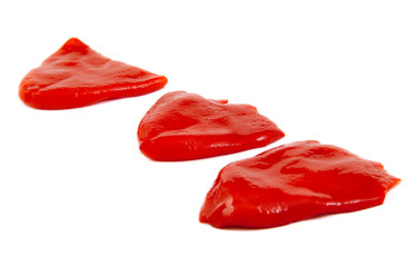 Roasted red peppers in olive oil isolated on white background