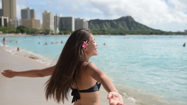 Beach woman in bikini on Waikiki, Oahu, Hawaii